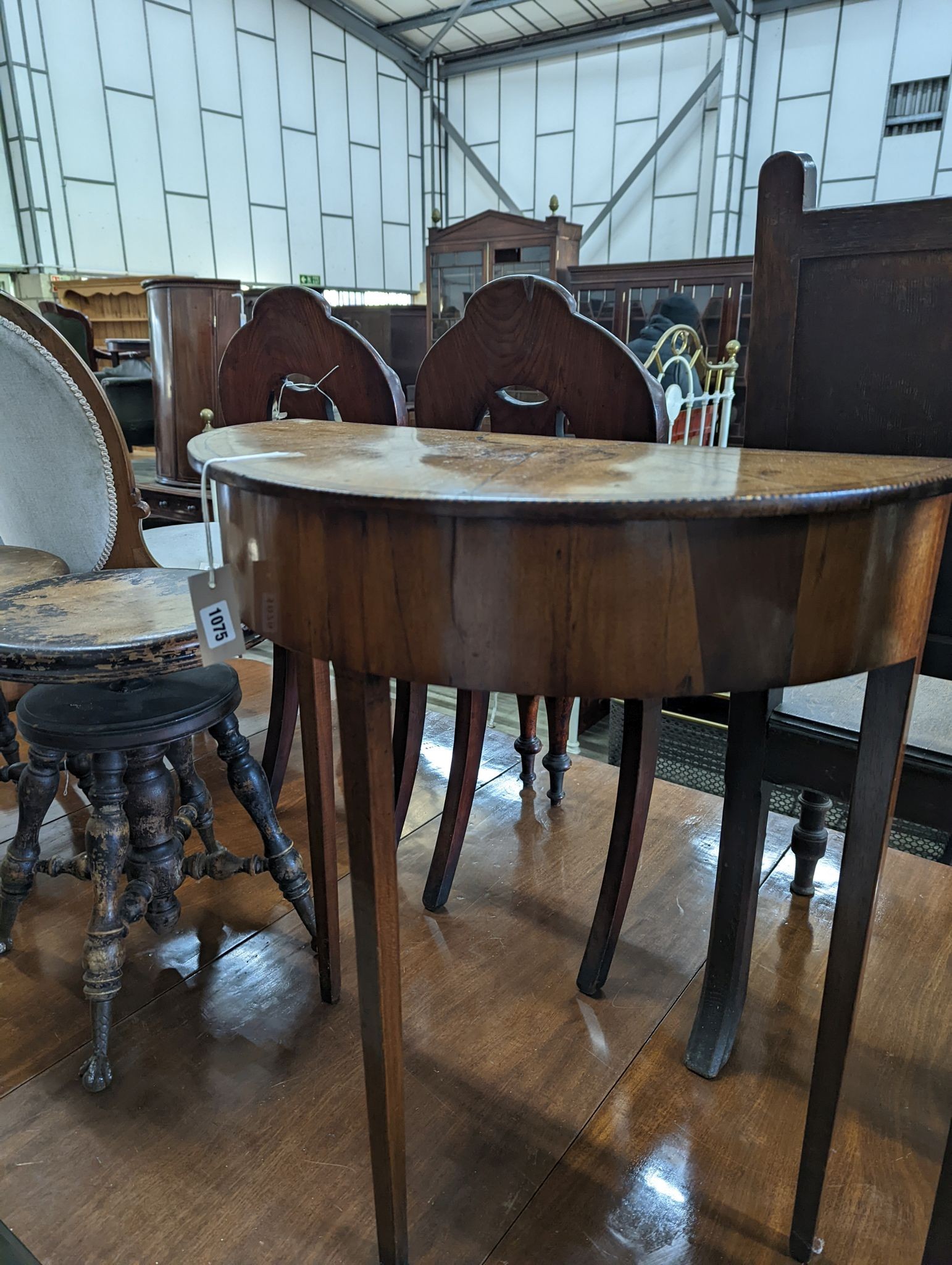 A pair of George III style inlaid mahogany D shaped side tables, width 64cm, depth 32cm, height 71cm